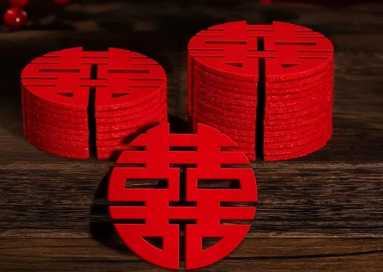 May include: A stack of red coasters with a Chinese double happiness symbol. The coasters are made of wood and have a smooth finish.