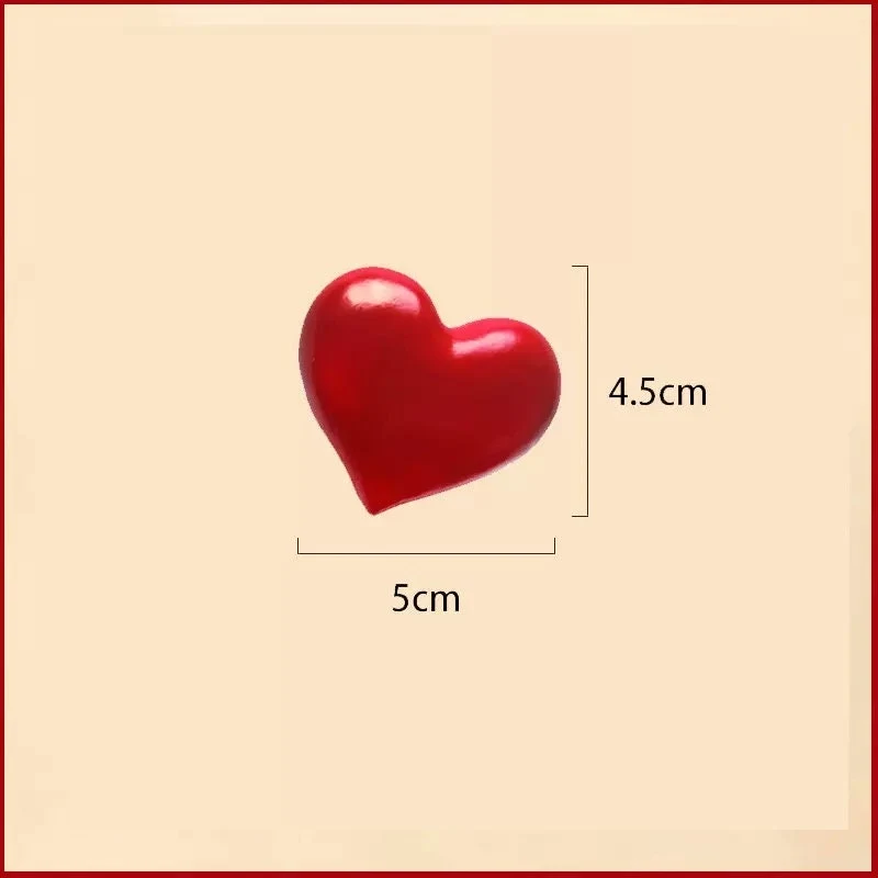 May include: A red heart-shaped object measuring 5 inches by 4.5 inches.