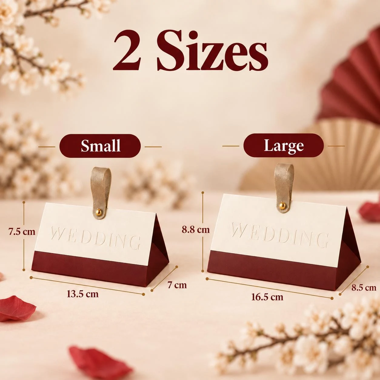 May include: Two triangular boxes with a cream top and dark red base, each featuring a gold-toned tab and the embossed text WEDDING. The small box measures 7.5 cm by 13.5 cm by 7 cm, and the large box measures 8.8 cm by 16.5 cm by 8.5 cm.