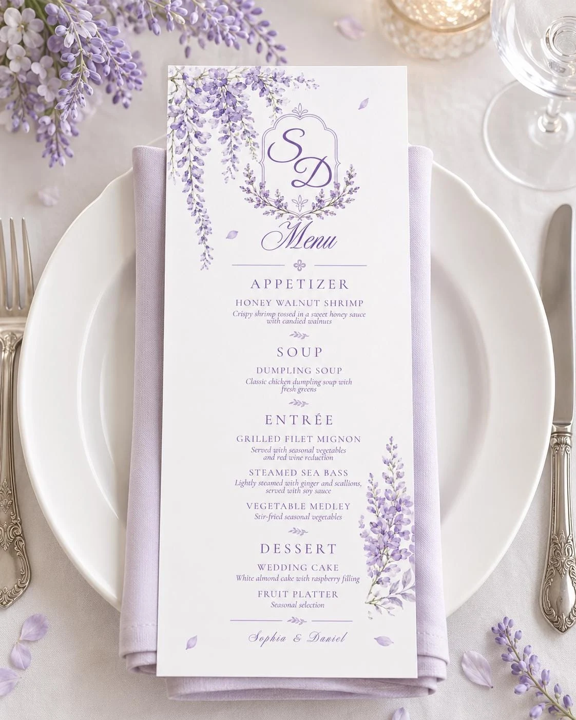 May include: A vertical white menu card featuring purple wisteria floral illustrations, a monogram with the letters SD, and the text Menu, Appetizer, Soup, Entree, Dessert, and Sophia & Daniel, placed on a light purple napkin and white plate.
